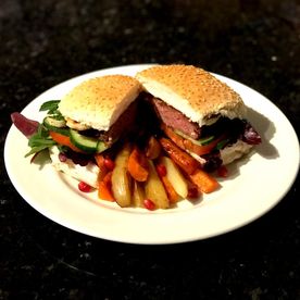 Shropshire Hills Catering Homemade Lamb and Mint Burger with a Crisp Fresh Salad and Halloumi, with Potato and Carrot Chips.