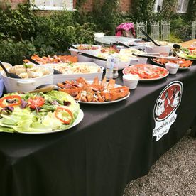 salads and side set up for and outdoor party